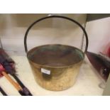 A brass jam pan