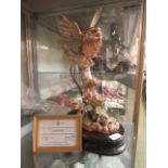 A sculpture of owl on branch with certificate of Hereford fine china titled 'little owl' model no.