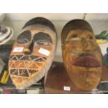 Two carved wooden African masks