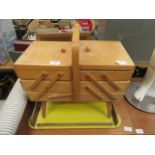 A cantilever sewing box with contents together with a mid-20th century yellow based tray