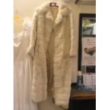 A white simulated fur coat
