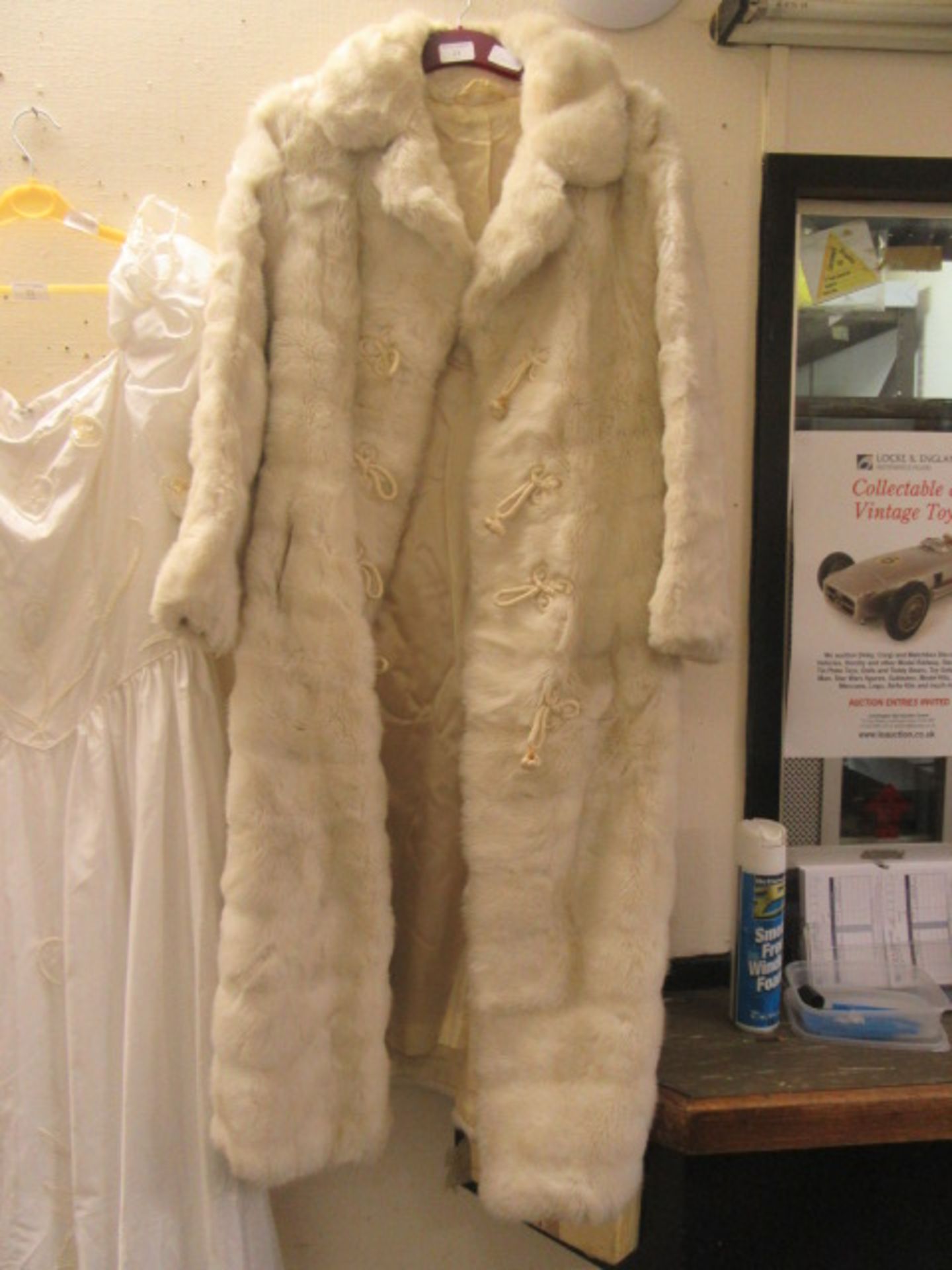 A white simulated fur coat