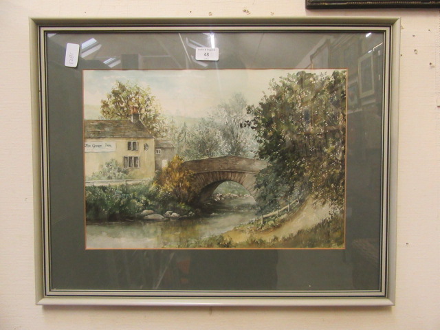 A framed and glazed watercolour of bridge next to pub scene signed Wright 1982