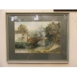 A framed and glazed watercolour of bridge next to pub scene signed Wright 1982