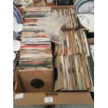 A tray of 45RPM records by various artists