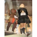 A small child's doll together with a continental ceramic headed doll in the form of Scotsman