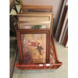 A tray containing a selection of framed artworks to include prints, photographs,