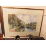 A framed and glazed possible watercolour of a gentleman walking by a lake signed bottom right