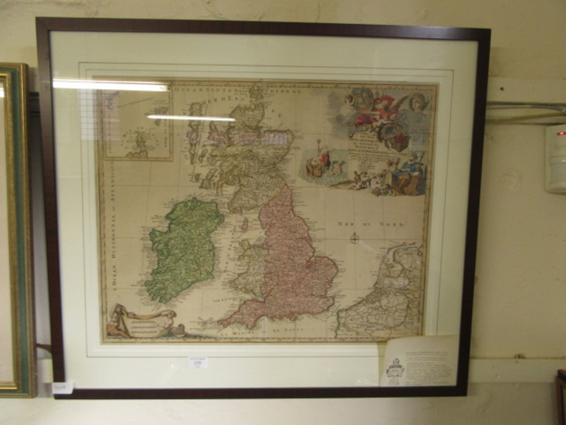 A framed and glazed coloured map of United Kingdom