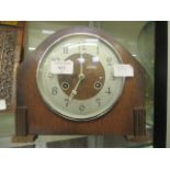 An oak cased mantle clock