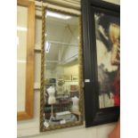 A gilt framed rectangular bevel glass mirror