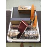 A tray containing plated ware to include flatware, sauce boats,