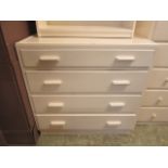 A white painted chest of four drawers