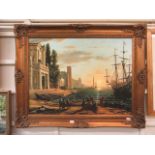 An ornate gilt framed print on canvas of continental city scene