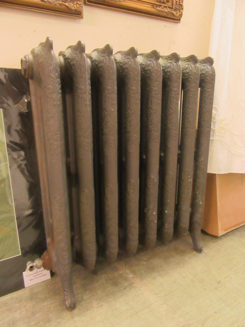 A 19th century cast iron ornate radiator (A/F)