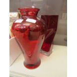 Two red glass vases