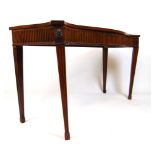 An 18th century mahogany serpentine side table,