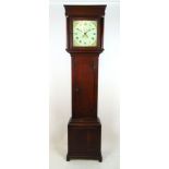 An 18th century oak long case clock, the face with Roman numerals,