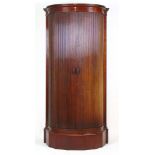 A 19th century mahogany tambour front wardrobe,