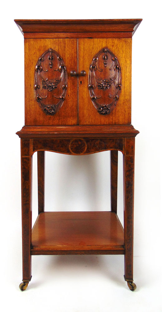 An Edwardian walnut music cabinet,