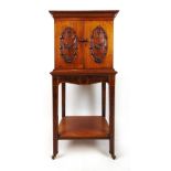 An Edwardian walnut music cabinet,