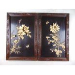 A pair of early 20th century Japanese lacquered and carved bone plaques depicting flowers, h.