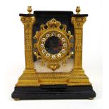 A 19th century French ormolu and mirrored metal cased mantle clock,