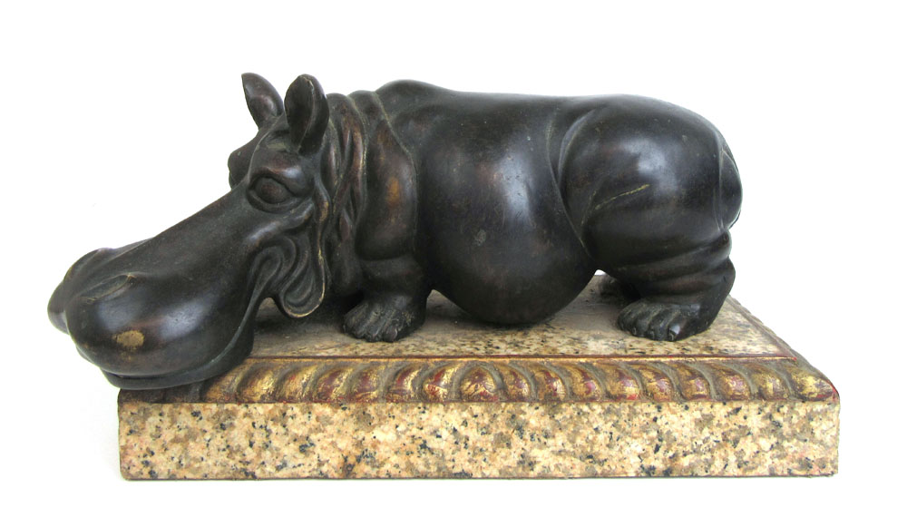 A stylized bronze model of a hippo on a marble and gilt wood base, l.