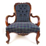 A Victorian walnut salon chair upholstered in a button back check fabric,