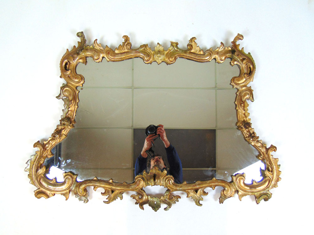 An 18th century giltwood Rococo mirror,