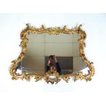 An 18th century giltwood Rococo mirror,