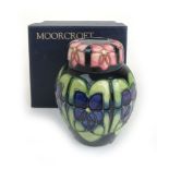 A small Moorcroft Violets pattern ginger jar, h.