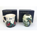 A Moorcroft Mackintosh design mug together with a Moocroft ovoid vase decorated on a cream ground,