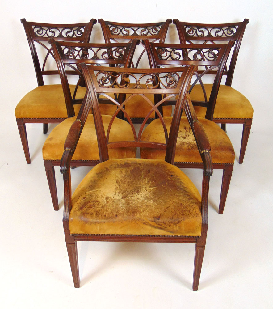 A set of six (5+1) 19th century French mahogany dining chairs upholstered in yellow suede,