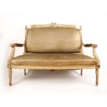 A 19th century distressed cream two seat settee, the carved and moulded frame on turned legs, h.