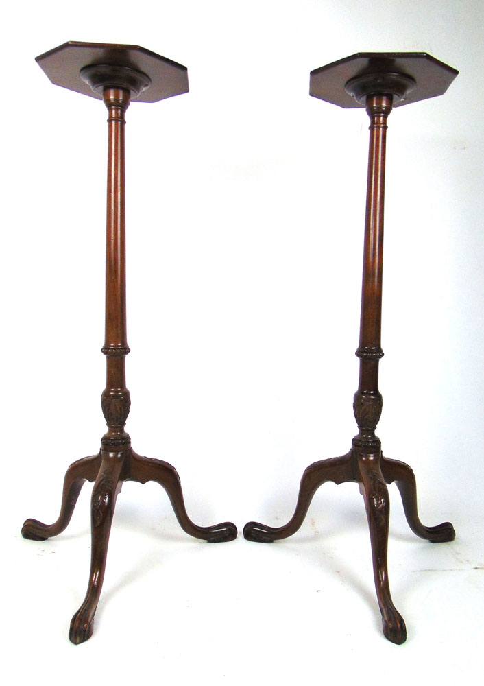 A pair of antique 18th century style mahogany and banded torchere's,