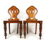 A pair of 19th century oak shield back hall chairs with solid seat on turned legs, h. 86 cm, w.