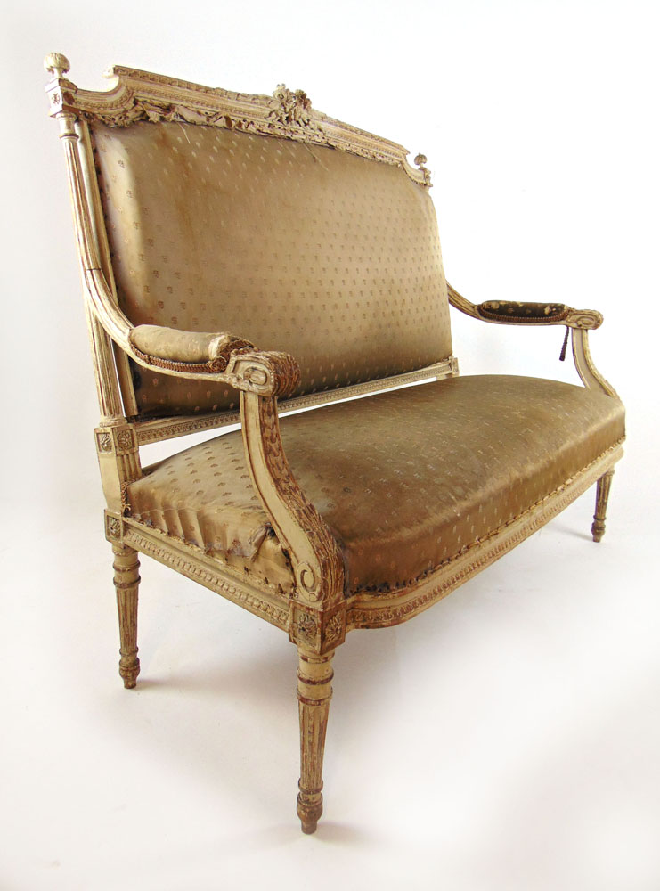 A 19th century distressed cream two seat settee, the carved and moulded frame on turned legs, h. - Image 2 of 2