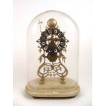A 19th century brass skeleton clock under glass dome with a chain fusee movement on a white marble