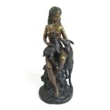A bronze sculpture of a nude lady with animals, h.