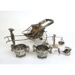 A collection of Chinese white metal cruet and novelty items to include a rickshaw cruet holder,