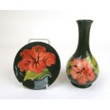 A Moorcroft Hibiscus pattern bottle vase together with a matching pin dish, h.