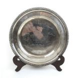 A Victorian silver circular dish with later presentation inscription.