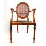 A late 18th century satin birch and hand painted open armchair,