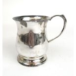 An Elizabeth II silver presentation tankard of baluster form. Hallmarked for Birmingham 1963.