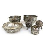 A collection of Indian and eastern white metal items to include bowls and cruet items.