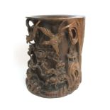 A large Chinese hardwood brush pot with relief carved scenes of birds amidst foliage, h.