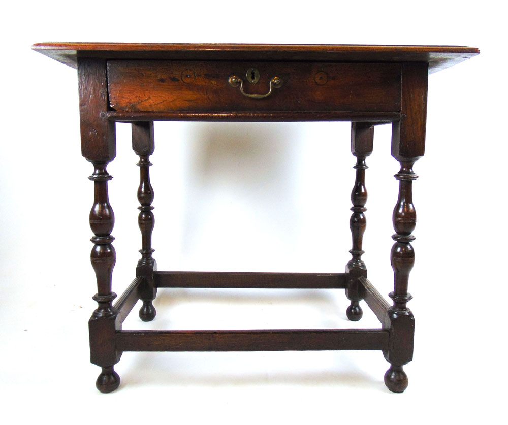 An early 18th century oak side table,