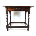 An early 18th century oak side table,