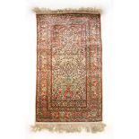 A handwoven Persian silk prayer rug,